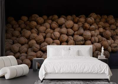 Ripe walnuts on a wooden background Wall mural