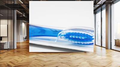 Toothbrush in package on white background Wall mural