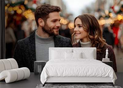 Romantic couple enjoying a festive winter market stroll Wall mural