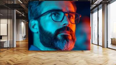 Thoughtful man in vibrant lighting portrait Wall mural