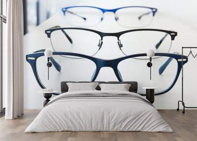 Blue and Black Eyeglasses on White Background Wall mural