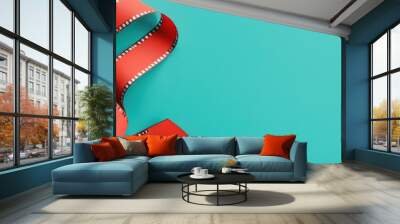 Red Film Strip on Turquoise Background   Minimalist Cinema Concept Wall mural