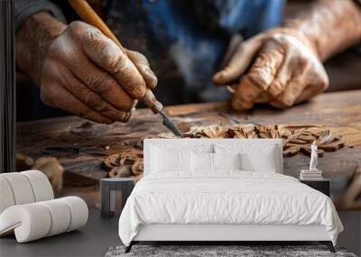 A man is carving a design into wood with a knife. The man is wearing gloves and he is focused on his work. Concept of craftsmanship and dedication to the task at hand Wall mural