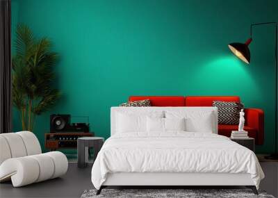 A red couch sits in front of a green wall. A black record player sits on a table next to the couch Wall mural