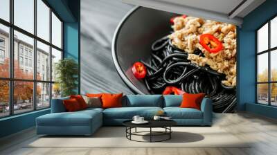 delicious black spaghetti pasta on a black rustic wooden background Wall mural