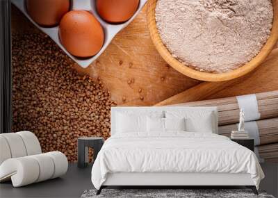 fresh natural buckwheat flour on a wooden rustic background culinary concept Wall mural