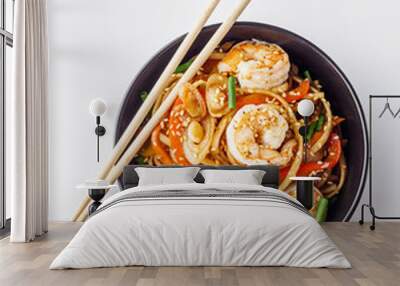 fried noodles wok shrimp on a white background Wall mural