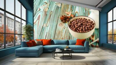 sweet crunchy chocolate children's breakfast chocolate balls on a wooden rustic background Wall mural