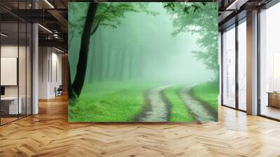 A winding pathway leads through a misty forest, creating an enchanting and tranquil atmosphere. The path symbolizes a journey, discovery, and the beauty of nature. Wall mural