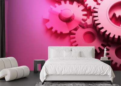 Pink gears interlock on a pink background, symbolizing teamwork, collaboration, connection, partnership, and synergy. Wall mural