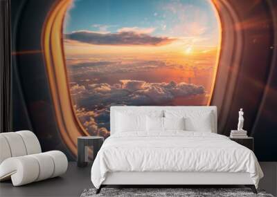 A mesmerizing view of the sunset through an airplane window, showcasing a vibrant sky, fluffy clouds, and golden rays of light. The image symbolizes freedom, travel, and the beauty of nature. Wall mural