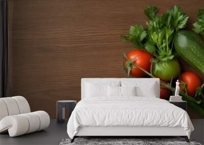 A vibrant assortment of fresh vegetables, including tomatoes, zucchini, bell peppers, and parsley, arranged on a rustic wooden surface. This image symbolizes health, freshness, and the bounty of natur Wall mural