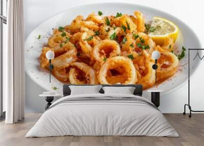 Deliciously crispy fried calamari rings served on a white plate with a lemon wedge and parsley garnish. A classic seafood appetizer. Wall mural