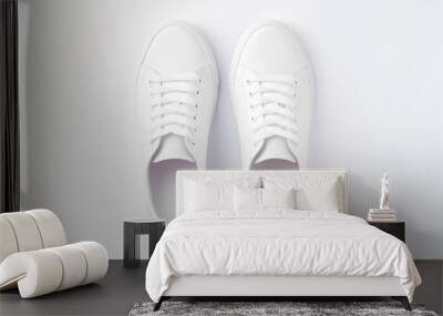 A pair of white sneakers on white backgrounds Wall mural