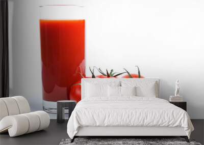 Tasty tomato juice and tomatoes over white. Wall mural