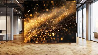 A cascade of golden dust particles, shimmering against a backdrop of pure darkness, akin to a cosmic event Wall mural