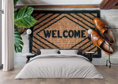 Top view of a welcome doormat mat sits in front of a door with a pair of shoes on it Wall mural