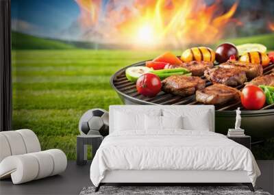 Delicious grilled meat and vegetables sizzling on barbecue with soccer ball on green meadow background, bbq, grill, food Wall mural