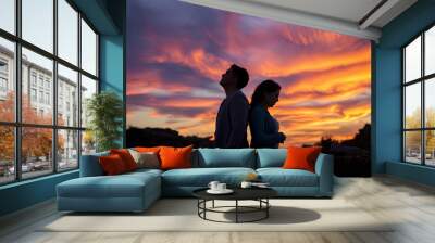 A couple silhouette background looking in different direction , in marriage clash and about to get divorce or to separate, woman and man separation or breakup partner feel unhappy of conflict fight Wall mural