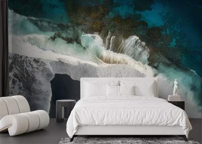 Aerial drone view or top view perspective photography of a beautiful transparent clear sea ocean beach waves and foam splashing on the dark blue or gray sand coast island holiday tropical surf texture Wall mural