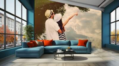 embrace of happy romantic couple explore the world of beautiful Wall mural