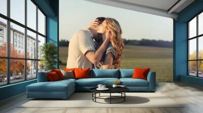 stunning sensual young couple in love embracing at the sunset Wall mural