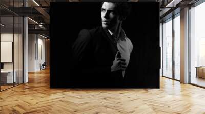 Thinking depression charismatic man looking up on dark shadow dramatic light background. Closeup portrait. Black and white. Art Wall mural