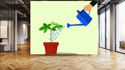 Vector Hand holding watering can watering plant in pot. flat design Wall mural