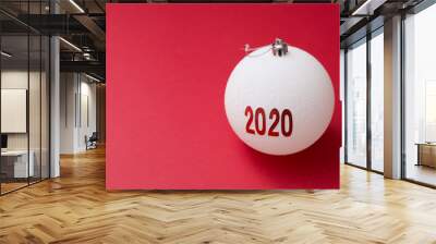 white new year ball 2020 on red background with copy space. greeting card Wall mural