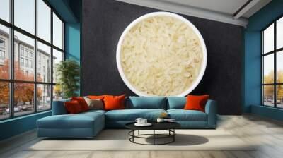 A glass bowl with white long-grain rice Wall mural