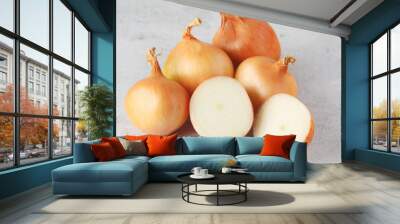 Golden onion bulbs on the table	 Wall mural