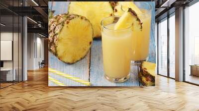 Two glasses with pineapple juice Wall mural