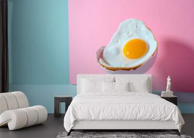 Fried egg sitting and relaxing in broken eggshell chair. Fun minimal style, surreal concept of  dining room, home, resting and relaxation. Comfort, coziness.  pastel colors background with copy space. Wall mural