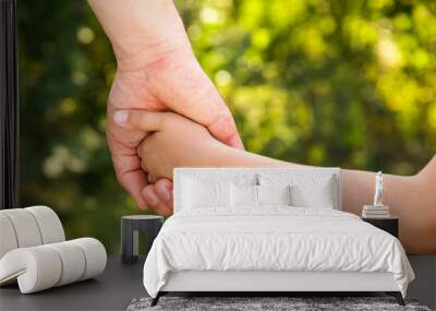 father holding  daughter hand Wall mural