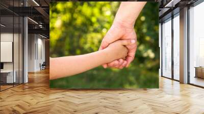 father holding  daughter hand Wall mural