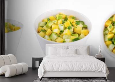 Mango avocado cucumber salad in a bowl on a white isolated background Wall mural