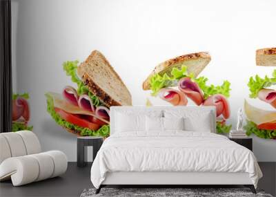 Sandwich with whole grain bread, salad, cheese, tomato and ham on a white isolated background Wall mural