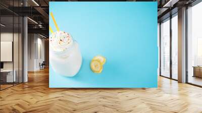 Sweet banana milkshake in a glass Wall mural