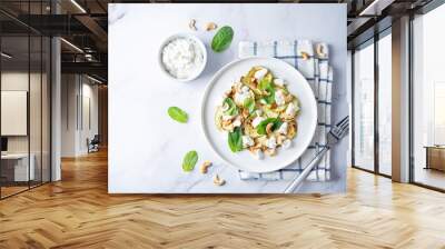 Zucchini ricotta cashew mint salad in a plate Wall mural