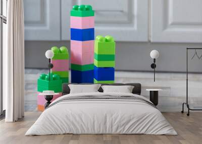 Building kit toy towers on the floor close up. Wall mural