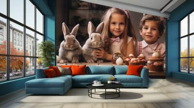 Children with Easter bunnies on table, Concept of holiday celebration Wall mural