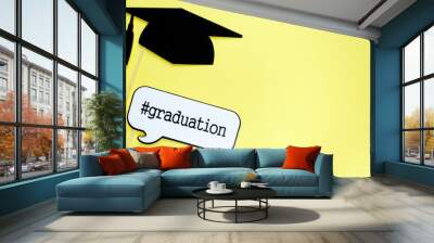 Creative background with photobooth props for graduation: hats, diploma, glasses, lips on bright yellow paper background. Education, study concept.  Wall mural