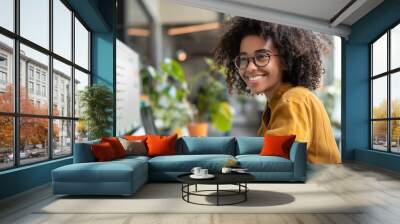 Smiling customer service representative working on computer in office Wall mural