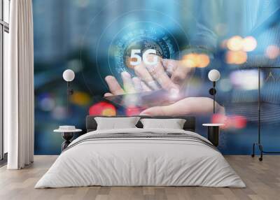 Hand of a businessman shows 5G . Wall mural