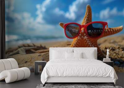 A cheerful starfish wearing stylish sunglasses relaxing on a sunny beach by the ocean Wall mural