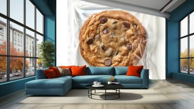 A chocolate chip cookie in a plastic bag. AI. Wall mural