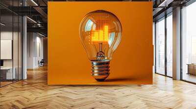 A light bulb with a bar chart inside, illustrating ideas in business growth Wall mural