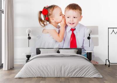 Girl and boy whispering Wall mural