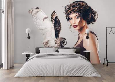 Portrait of beautiful young girl with owl Wall mural