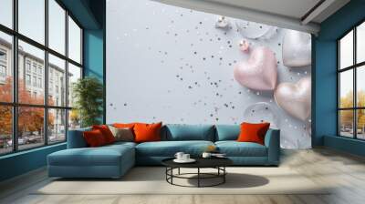 Glittery hearts and ribbons on a pastel blue festive background Wall mural